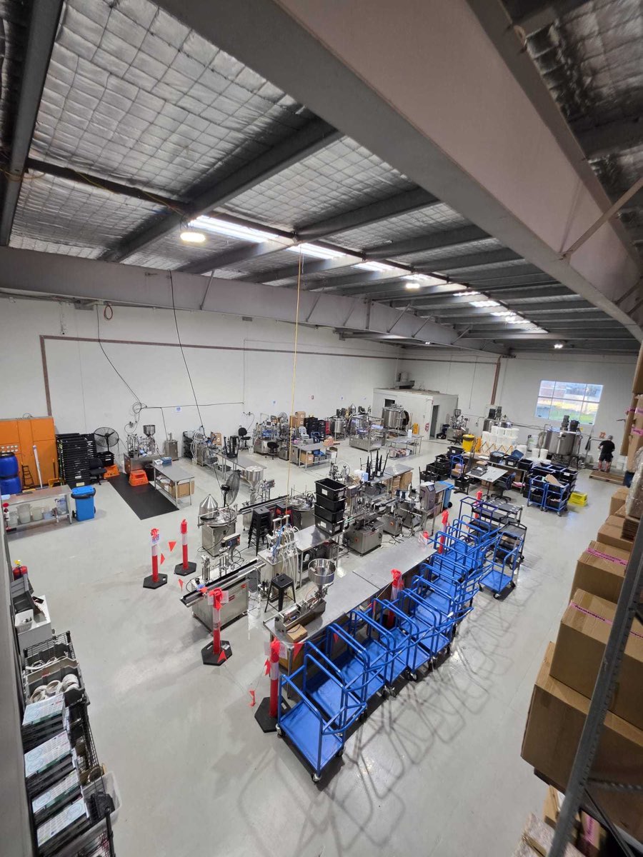 The NEXT LABS production floor in Burleigh Heads, with filling lines and batching tanks
